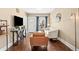 Cozy living room showcasing hardwood floors, a comfortable seating arrangement, and natural light at 1847 W 41St Ave, Denver, CO 80211