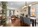 Open-concept living area with hardwood floors, comfortable seating, and a dining space at 1847 W 41St Ave, Denver, CO 80211