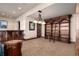 Finished basement featuring a custom bookcase with rolling ladder and a full wet bar at 2208 Stevens Ct, Castle Rock, CO 80109
