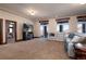 Finished basement with plush carpet, walk-out access to patio, large sectional couch and media center at 2208 Stevens Ct, Castle Rock, CO 80109