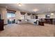 Spacious basement featuring a wet bar, recessed lighting, plush carpet, and a large sectional couch at 2208 Stevens Ct, Castle Rock, CO 80109
