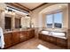 Elegant bathroom with double vanity, granite counters, soaking tub and natural light at 2208 Stevens Ct, Castle Rock, CO 80109