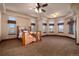 Spacious bedroom with large windows and a custom bed frame featuring nature-themed design at 2208 Stevens Ct, Castle Rock, CO 80109