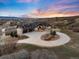 Stunning home boasts three-car garage, circular driveway, and beautiful landscaping with mountain views at 2208 Stevens Ct, Castle Rock, CO 80109