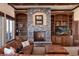 Cozy living room features a stone fireplace, built-in shelving, and a comfortable seating area at 2208 Stevens Ct, Castle Rock, CO 80109