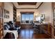 Elegant office features a large window with mountain views, custom built-ins, and an adjustable desk set up at 2208 Stevens Ct, Castle Rock, CO 80109