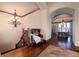 View of staircase leading up with a sitting area and view of the dining room at 2208 Stevens Ct, Castle Rock, CO 80109