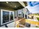 Cozy back deck with a table and chairs, perfect for outdoor dining and relaxation at 17955 Sky Pilot Ave, Parker, CO 80134