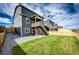 Inviting backyard with a green lawn, gravel, and a deck that offers relaxation and scenic views at 17955 Sky Pilot Ave, Parker, CO 80134