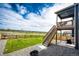 Well-maintained backyard with a staircase and fire pit with picturesque views at 17955 Sky Pilot Ave, Parker, CO 80134
