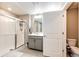 Modern bathroom with glass enclosed shower, gray vanity, and updated fixtures at 17955 Sky Pilot Ave, Parker, CO 80134