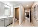 Hallway bathroom features a single vanity, tile flooring, and a toilet room at 17955 Sky Pilot Ave, Parker, CO 80134