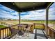 Inviting outdoor deck area with seating and neighborhood views in a desirable location at 17955 Sky Pilot Ave, Parker, CO 80134