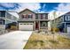 Charming two-story home with gray siding, red shutters, and a well-manicured front lawn at 17955 Sky Pilot Ave, Parker, CO 80134