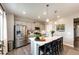 Modern kitchen with stainless steel appliances, large island, and sleek countertops at 17955 Sky Pilot Ave, Parker, CO 80134