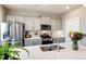Beautiful kitchen features stainless appliances, gray cabinets and modern countertops at 17955 Sky Pilot Ave, Parker, CO 80134