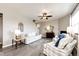 Bright living room features a fireplace, decorative window and modern furnishings at 17955 Sky Pilot Ave, Parker, CO 80134