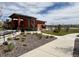 Community pool house with covered entrance, landscaping, and pool view adds a touch of luxury and relaxation at 17955 Sky Pilot Ave, Parker, CO 80134