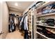Spacious walk-in closet with clothing racks, shelving, and a carpeted floor at 17955 Sky Pilot Ave, Parker, CO 80134