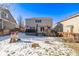 House with backyard, deck, and snowy ground at 1365 Mulberry Ln, Highlands Ranch, CO 80129