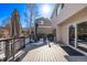 Deck with seating area and snowy ground at 1365 Mulberry Ln, Highlands Ranch, CO 80129