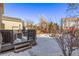 Large backyard with deck and snowy ground at 1365 Mulberry Ln, Highlands Ranch, CO 80129