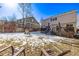 Large backyard with house and snowy ground at 1365 Mulberry Ln, Highlands Ranch, CO 80129