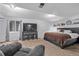 Spacious basement bedroom with a large bed and TV at 1365 Mulberry Ln, Highlands Ranch, CO 80129