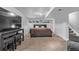 Finished basement bedroom with a TV and seating area at 1365 Mulberry Ln, Highlands Ranch, CO 80129