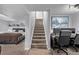 Basement stairs leading to a bedroom and office area at 1365 Mulberry Ln, Highlands Ranch, CO 80129