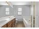 Bathroom with double vanity and garden tub at 1365 Mulberry Ln, Highlands Ranch, CO 80129