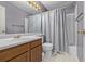 Clean bathroom with shower/tub combo and wood vanity at 1365 Mulberry Ln, Highlands Ranch, CO 80129