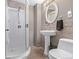 Clean bathroom with shower, toilet and pedestal sink at 1365 Mulberry Ln, Highlands Ranch, CO 80129