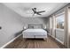 Bright bedroom with a ceiling fan and hardwood floors at 1365 Mulberry Ln, Highlands Ranch, CO 80129