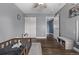 Well-lit bedroom with wood floors and built-in storage at 1365 Mulberry Ln, Highlands Ranch, CO 80129