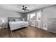 Primary bedroom with hardwood floors and ceiling fan at 1365 Mulberry Ln, Highlands Ranch, CO 80129