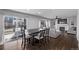 Kitchen and dining area combo with hardwood floors and patio access at 1365 Mulberry Ln, Highlands Ranch, CO 80129