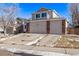 Two-story house with a three-car garage and brick facade at 1365 Mulberry Ln, Highlands Ranch, CO 80129