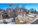 Two-story house with a three-car garage and snow-covered front yard at 1365 Mulberry Ln, Highlands Ranch, CO 80129