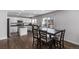 Modern kitchen with white cabinets, granite countertops, and island at 1365 Mulberry Ln, Highlands Ranch, CO 80129