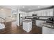 Modern kitchen with white cabinets and granite countertops at 1365 Mulberry Ln, Highlands Ranch, CO 80129