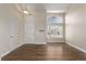 Living room with hardwood floors and large window at 1365 Mulberry Ln, Highlands Ranch, CO 80129