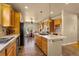 Large kitchen with island, tile floors, stainless steel appliances and breakfast nook at 17533 W 60Th Ln, Arvada, CO 80403