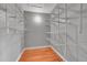 This walk-in closet has laminate floors and painted gray at 12023 E Harvard Ave # 203, Aurora, CO 80014