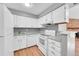 Updated kitchen with white cabinets, granite countertops, and stainless steel appliances at 12023 E Harvard Ave # 203, Aurora, CO 80014
