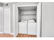 Laundry closet with full-size washer and dryer at 12023 E Harvard Ave # 203, Aurora, CO 80014
