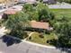 An aerial view of a charming property surrounded by lush trees, situated near a parking lot, showcasing its serene setting at 3780 W 66Th Ave, Arvada, CO 80003