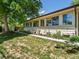 Backyard with a well-manicured lawn, garden beds, and a greenhouse at 3780 W 66Th Ave, Arvada, CO 80003