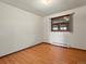 Bedroom featuring light wood laminate flooring, window and baseboard heating at 3780 W 66Th Ave, Arvada, CO 80003