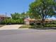 Ranch-style home with a spacious driveway and a well-maintained lawn surrounded by mature trees and shrubbery at 3780 W 66Th Ave, Arvada, CO 80003